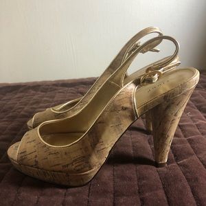 Peekaboo platform, cork-like design with gold trim. 3in heel. Barely worn.